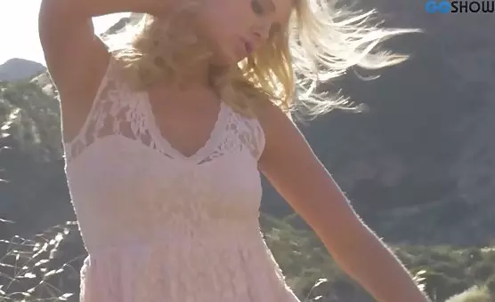 Blonde Siren Charms Outdoors with Seductive Exposure